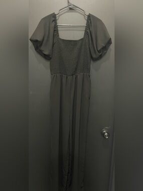 Elegant Black Romper with Puff Sleeves and Smocked Bodice